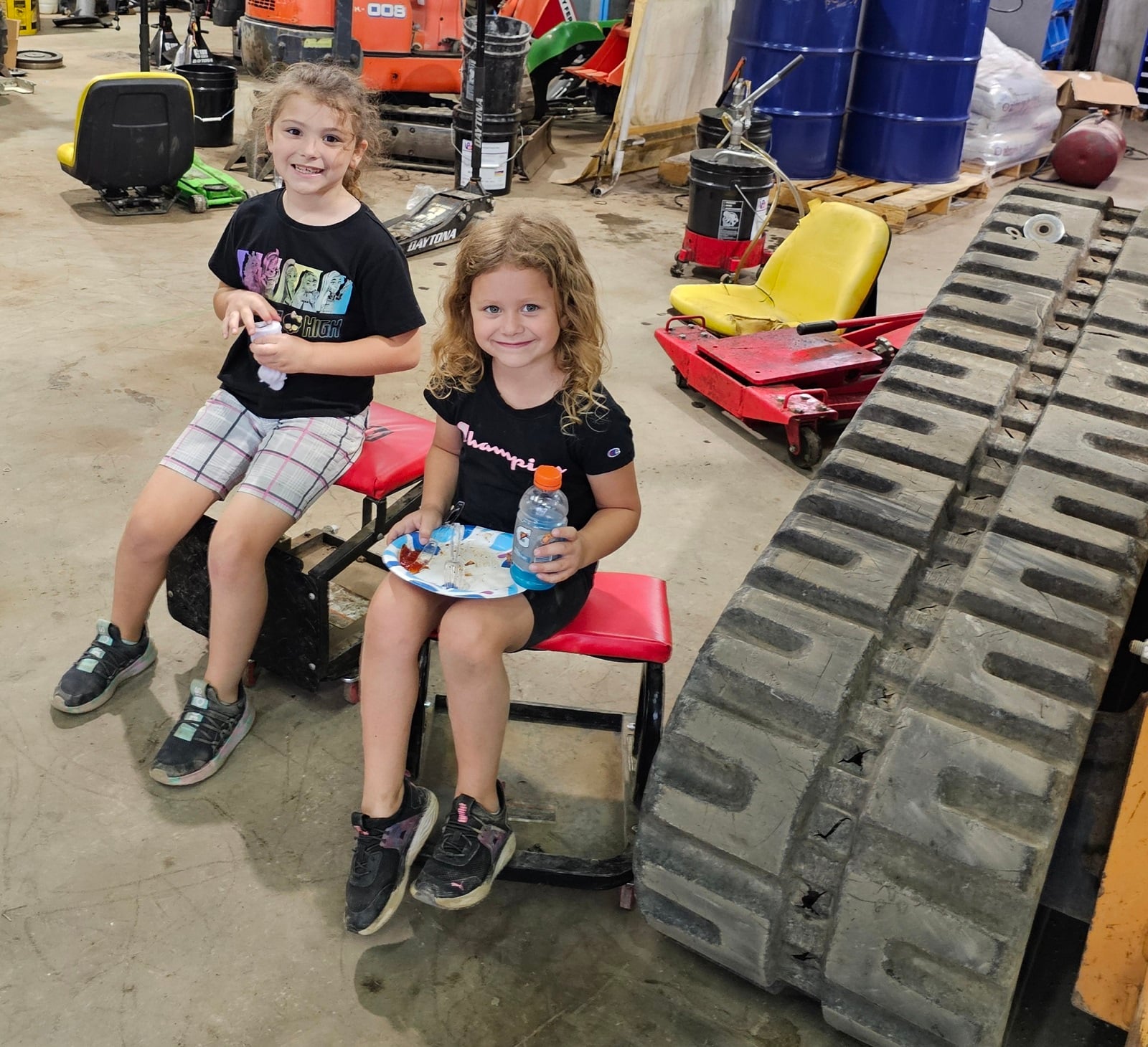 two kids near rubber tracks